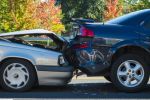 Auto accident involving two cars on a city street concept.