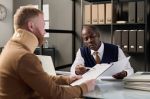 Comparative Negligence Attorney helping man with neck brace